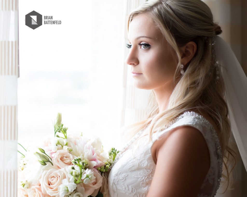 Bride looking through window