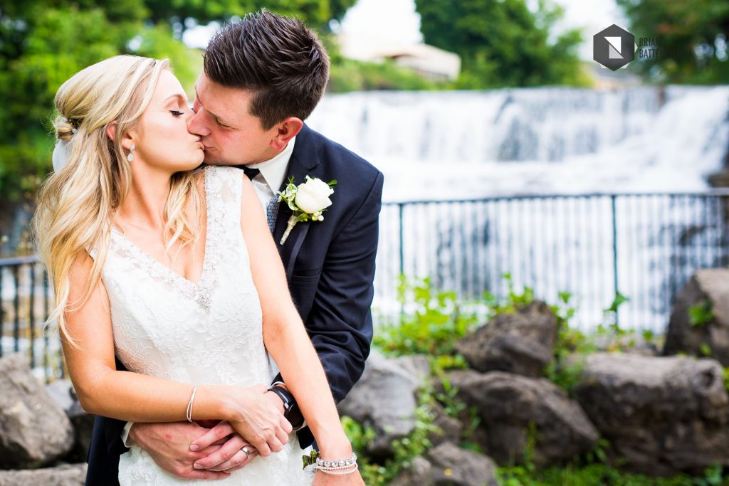 Bride and groom kissing at Glenn Falls